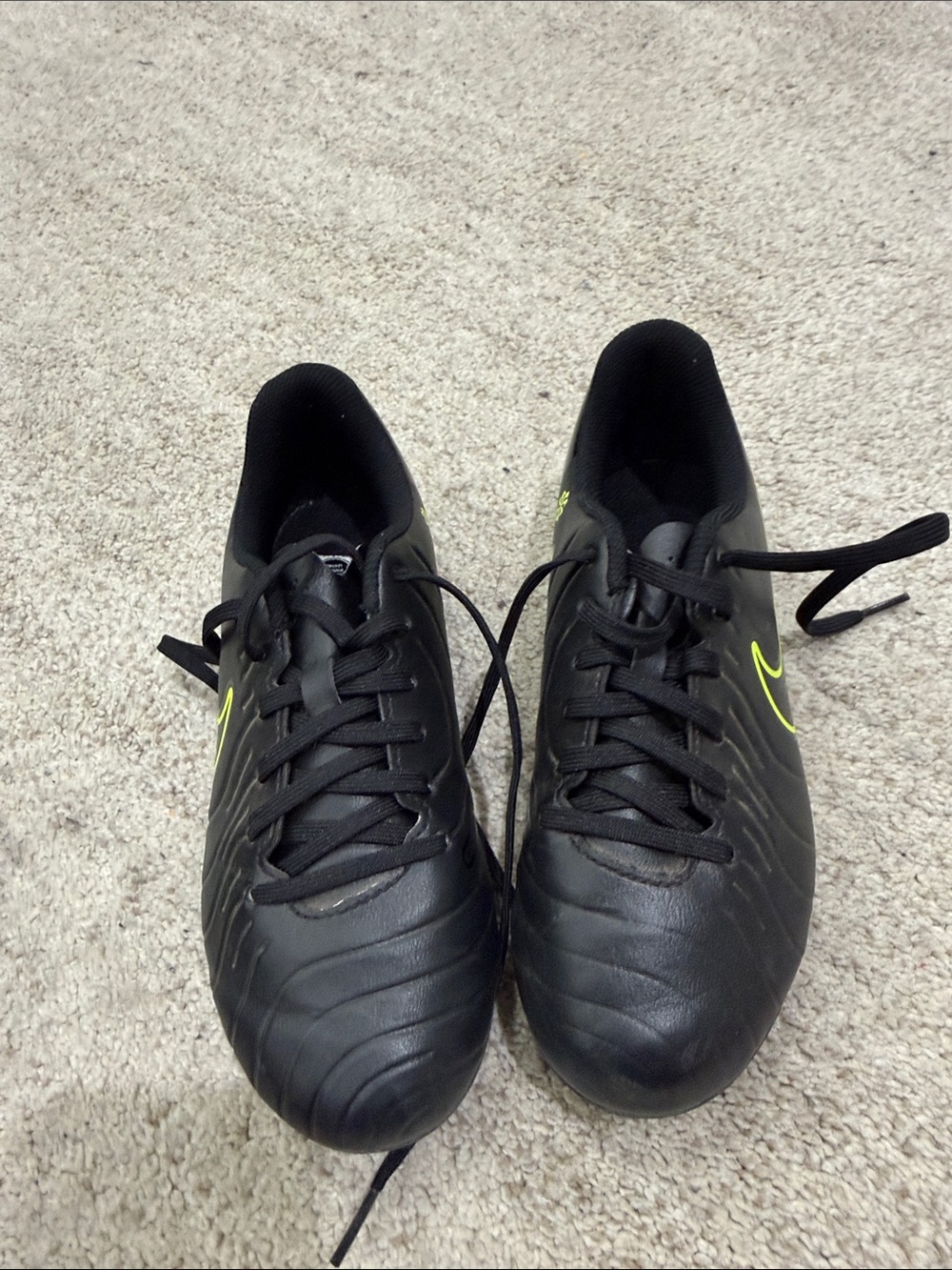 Nike Black Youth cleats with Neon Yellow Swoosh